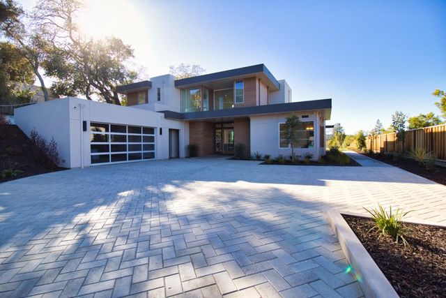 a bedroom with a bed and a night stand