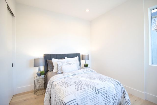 a view of a patio with couches and table and chairs and potted plants