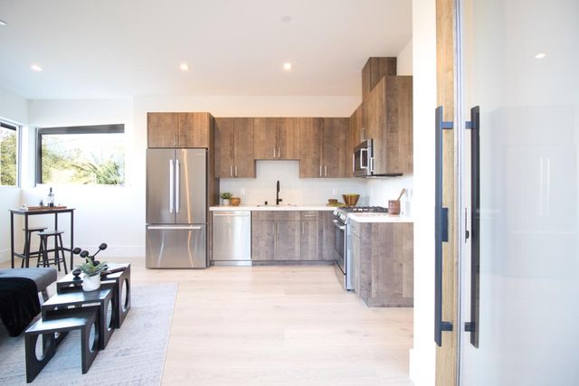an aerial view of a house with swimming pool garden and patio