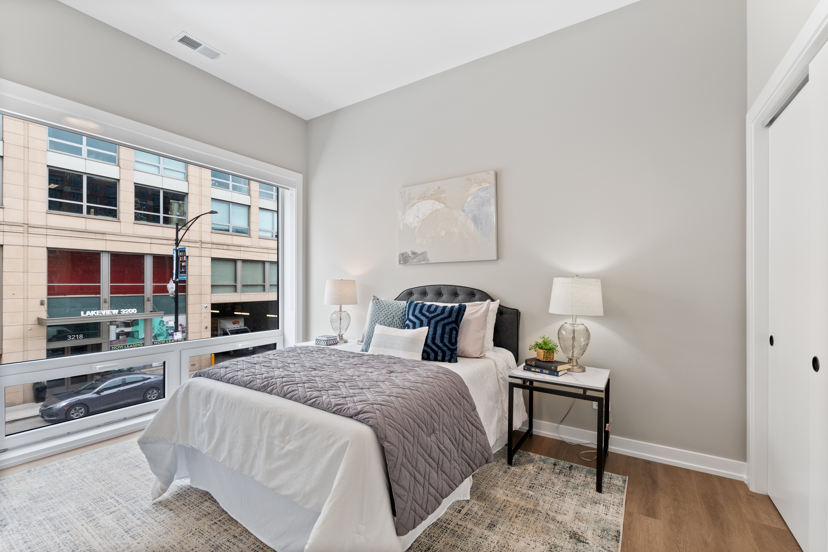 Undisclosed Address Chicago, IL 60657 - Photo 11 of 16 a bedroom with a bed and a flat screen tv