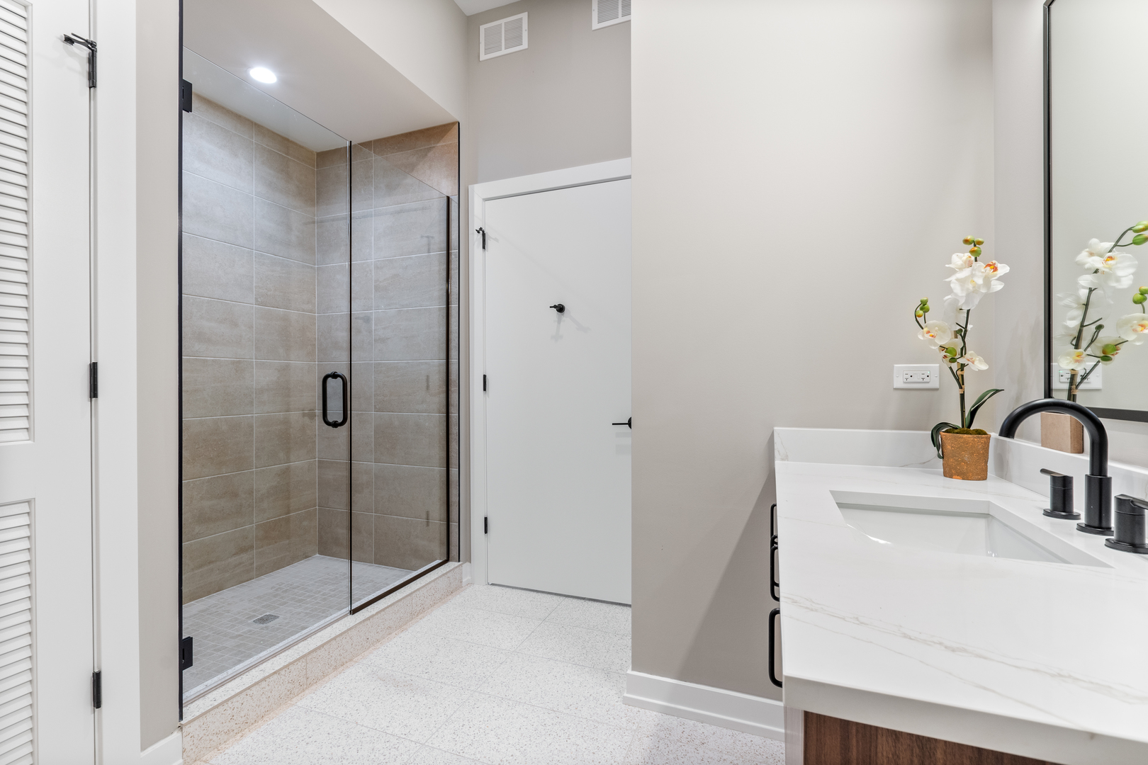 Undisclosed Address Chicago, IL 60657 - Photo 13 of 16 a bathroom with a shower sink and mirror