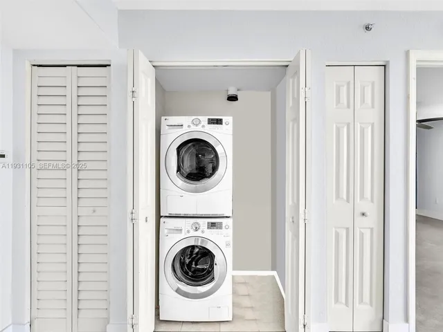 a bathroom with a white bath tub and a shower