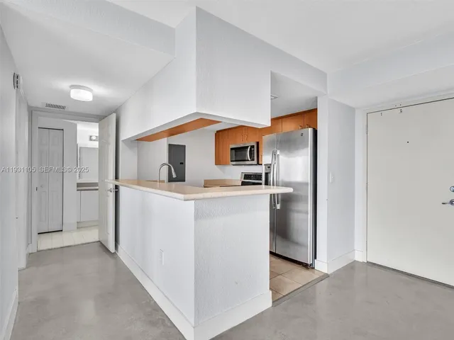 a kitchen with a stove microwave and refrigerator