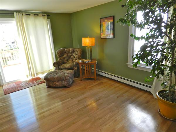 58 Pershing Road Boston, MA 02130 - Photo 13 of 30 a living room with furniture and a window