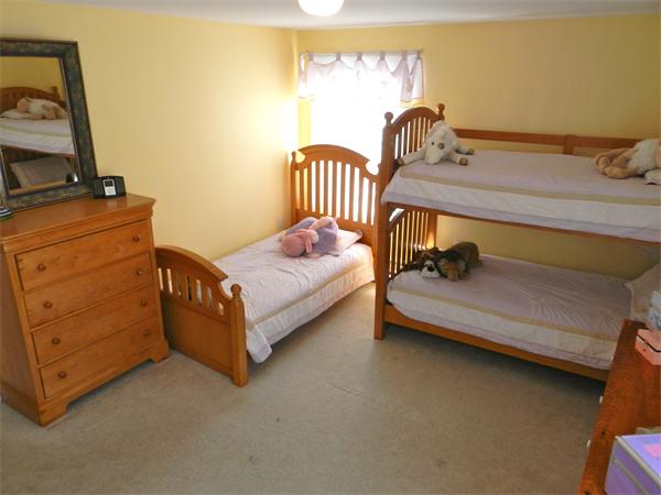 58 Pershing Road Boston, MA 02130 - Photo 19 of 30 a bedroom with a bed and a window