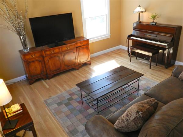 58 Pershing Road Boston, MA 02130 - Photo 5 of 30 a living room with furniture and a flat screen tv