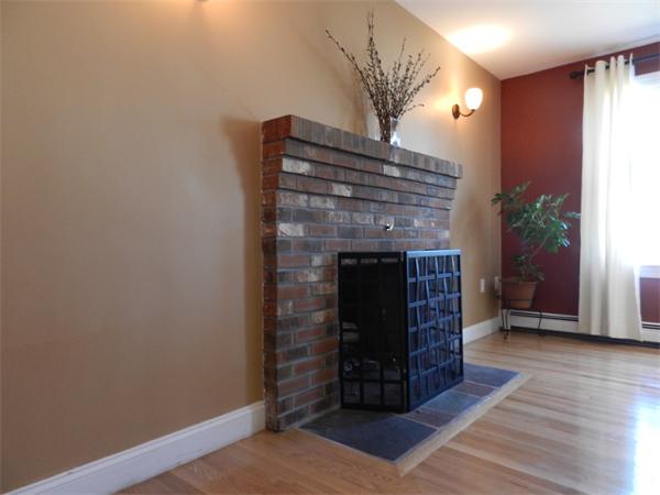 58 Pershing Road Boston, MA 02130 - Photo 6 of 30 a living room with furniture and a fireplace