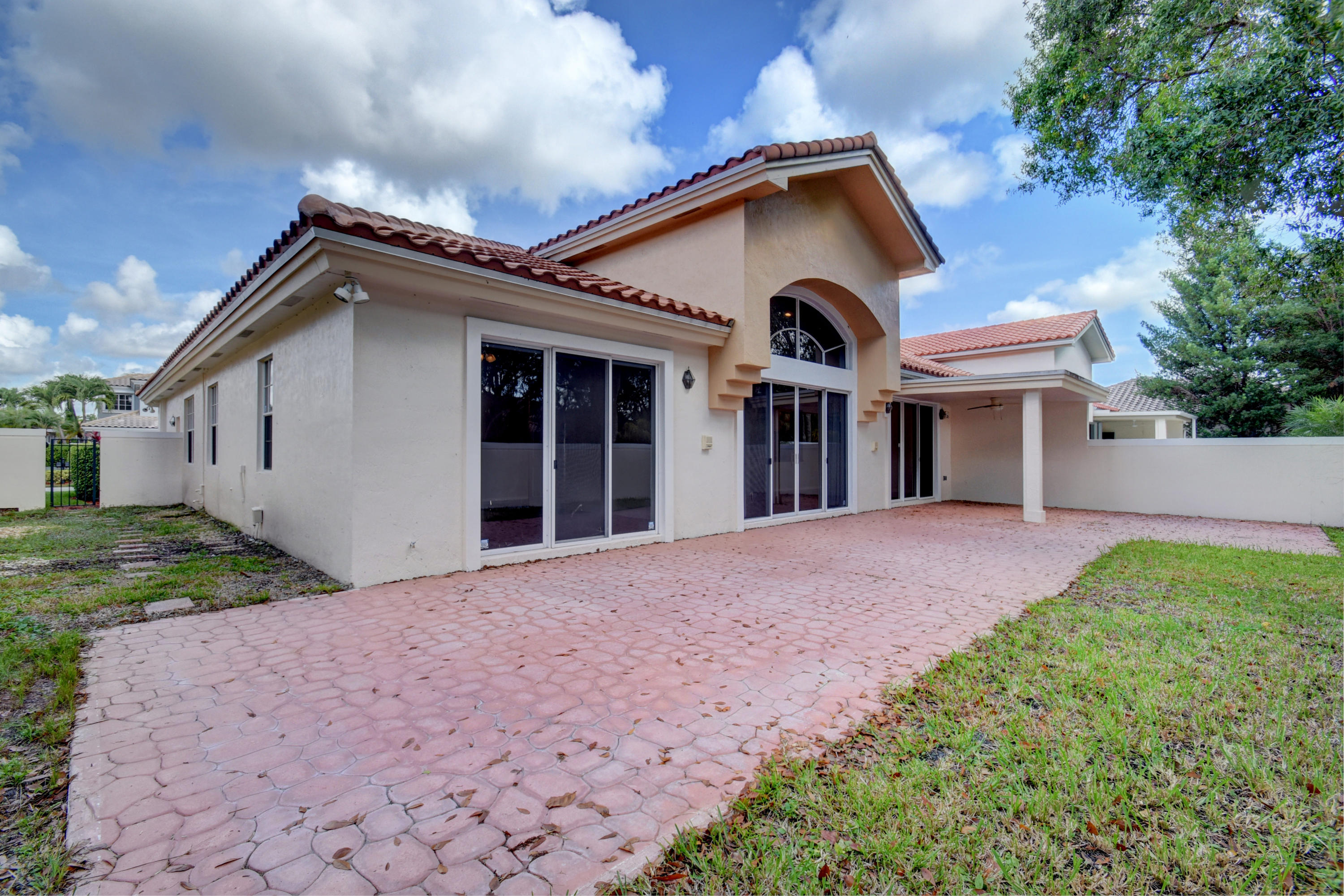 6286 Northwest 23rd Road Boca Raton, FL 33434 - Photo 31 of 44 a front view of a house with garden