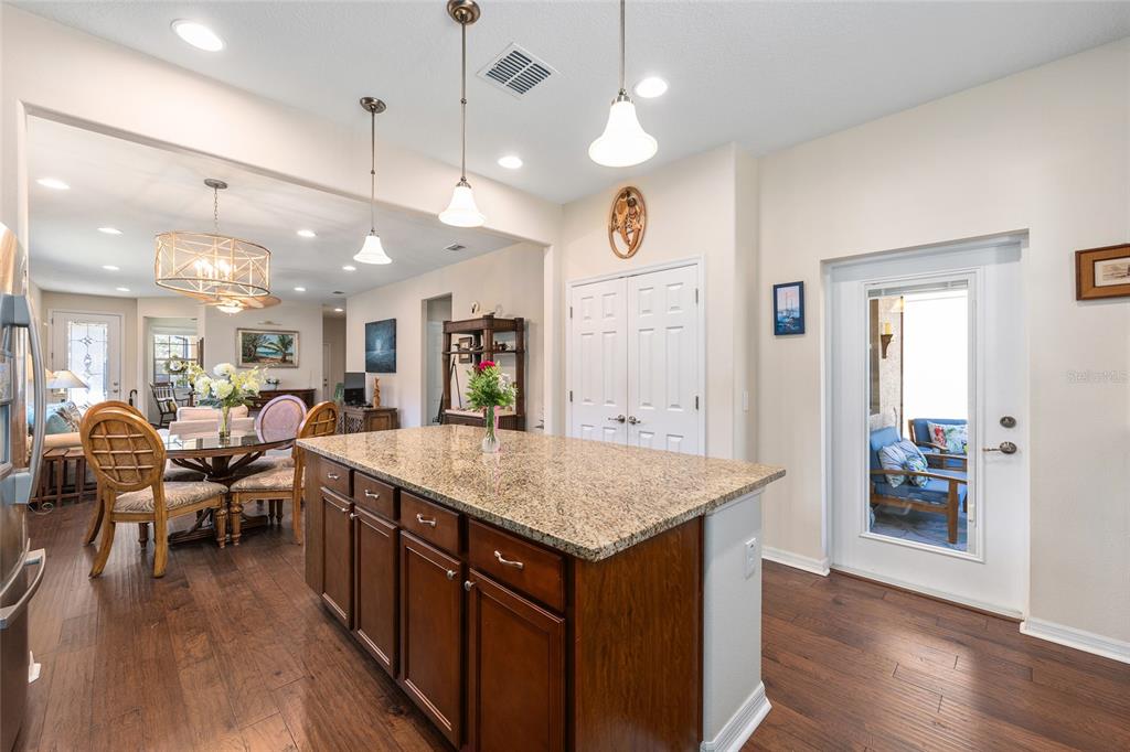 7676 Southwest 94th Circle Ocala, FL 34481 - Photo 15 of 45 a large kitchen with a table and chairs
