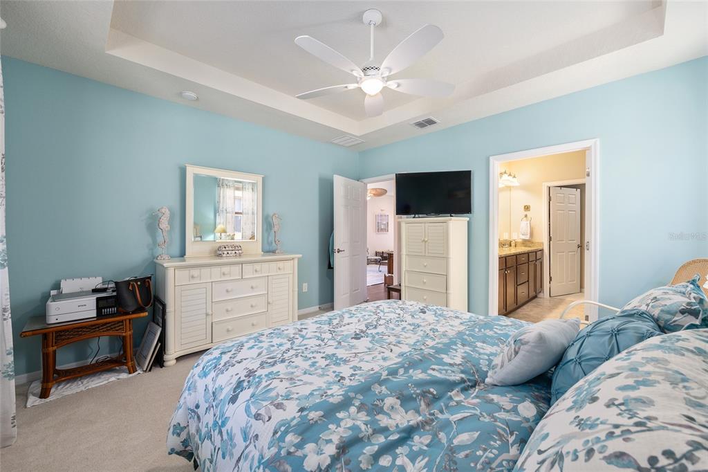 7676 Southwest 94th Circle Ocala, FL 34481 - Photo 19 of 45 a bedroom with a bed and a dresser