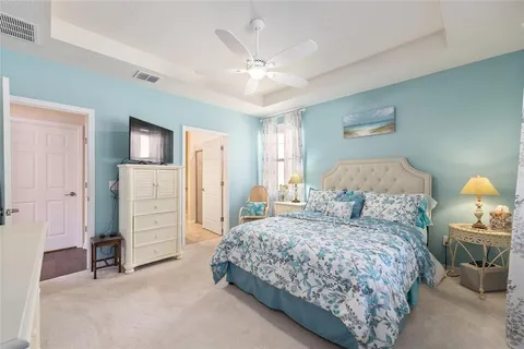 a bedroom with a bed and a tv