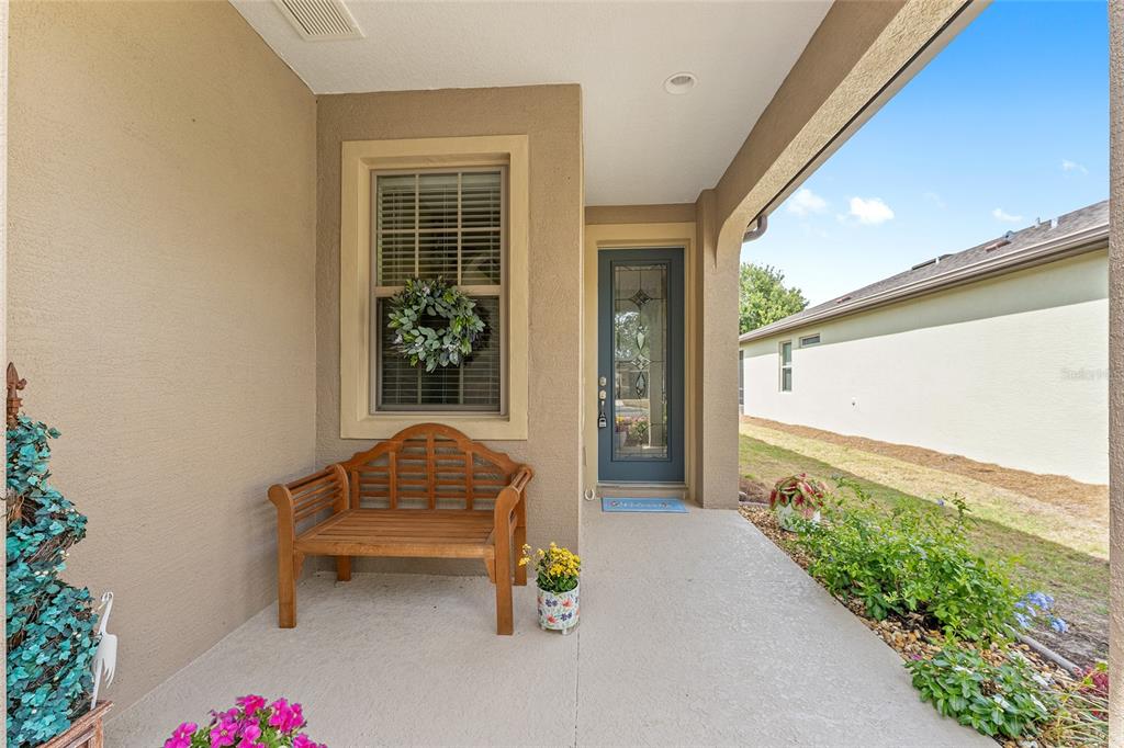 7676 Southwest 94th Circle Ocala, FL 34481 - Photo 2 of 45 a house view with a garden space