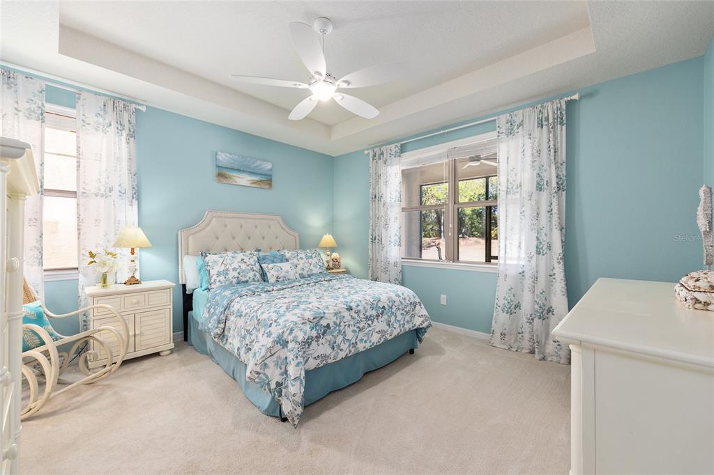7676 Southwest 94th Circle Ocala, FL 34481 - Photo 21 of 45 a bedroom with a bed and a table chair