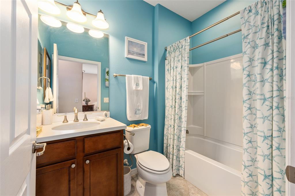 7676 Southwest 94th Circle Ocala, FL 34481 - Photo 25 of 45 a bathroom with a sink toilet and shower