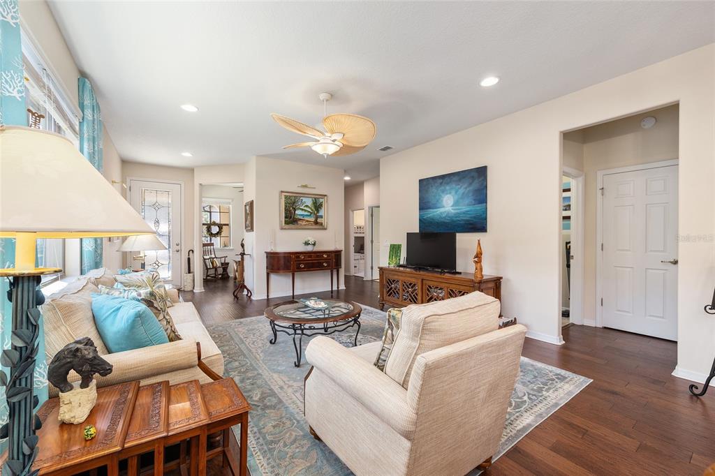 7676 Southwest 94th Circle Ocala, FL 34481 - Photo 28 of 45 a living room with furniture and a flat screen tv