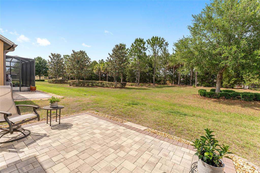 7676 Southwest 94th Circle Ocala, FL 34481 - Photo 4 of 45 a view of a swimming pool and lounge chairs