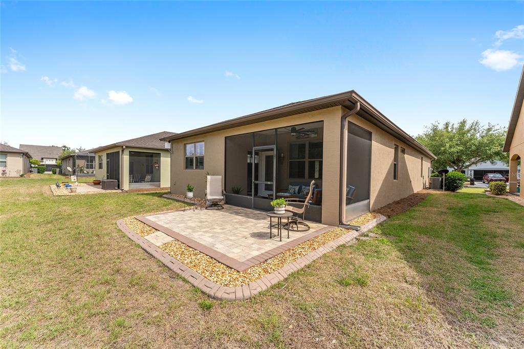 7676 Southwest 94th Circle Ocala, FL 34481 - Photo 41 of 45 a view of a house with backyard and sitting area