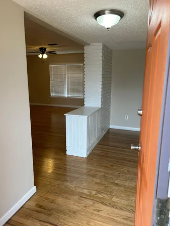 a view of entryway with wooden floor