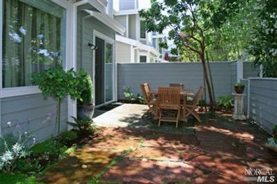 115 Gable Court San Rafael, CA 94903 - Photo 11 of 12 Spacious fenced yard with shade trees and flowers and newer flagstone patio.