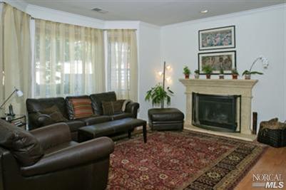 115 Gable Court San Rafael, CA 94903 - Photo 2 of 12 Hardwood floors through out, wood burning fireplace with a gracious mantle and surround, bay window,over head lighting and lots of wall space for your media set up or art.