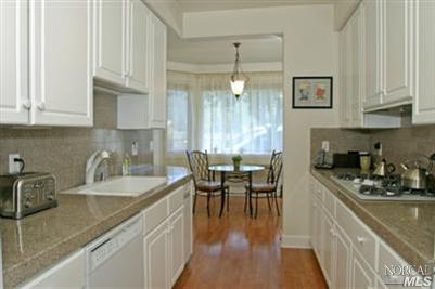 115 Gable Court San Rafael, CA 94903 - Photo 6 of 12 Bright and spacious kitchen with newer refrigerator, granite counter tops, and extra shelving in the many cabinets.