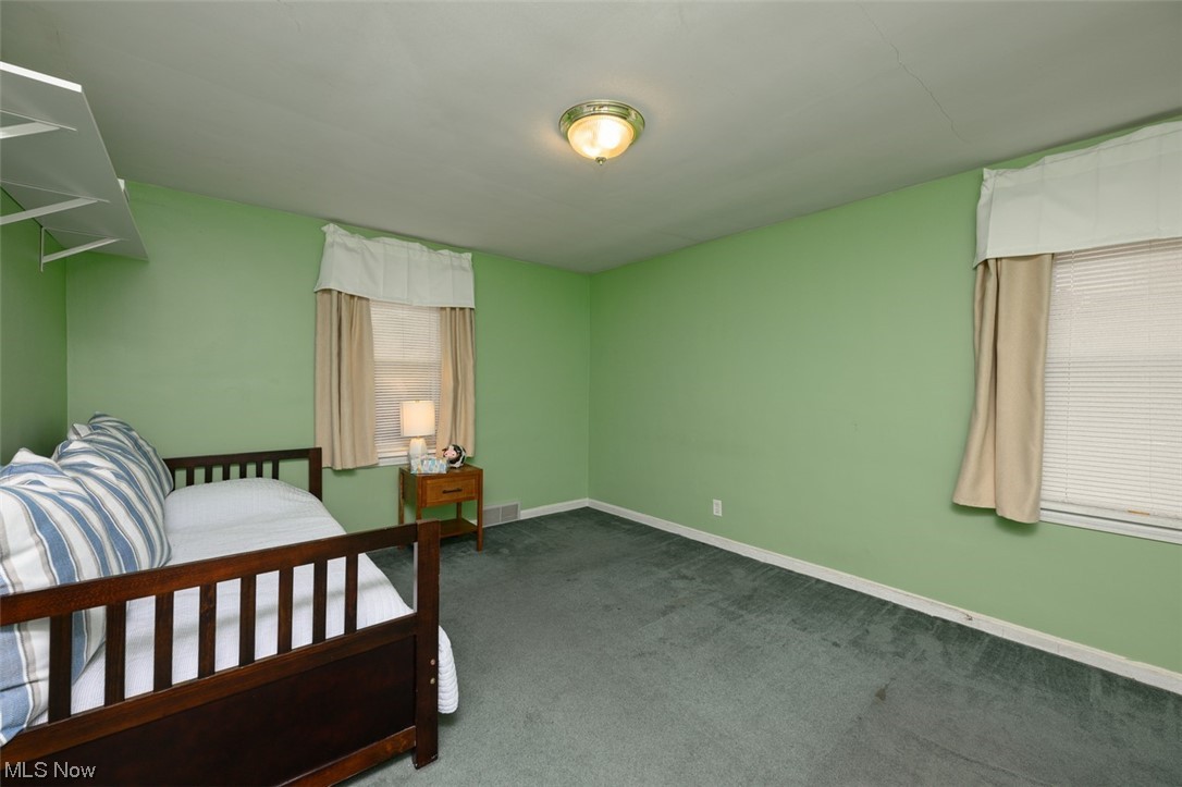 241 Everhard Road Southwest North Canton, OH 44709 - Photo 11 of 21 Additional angle of bedroom two with closet and carpet flooring