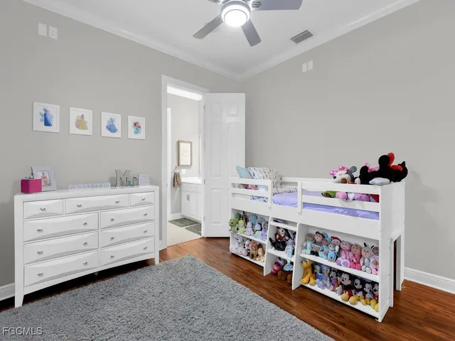 a room with toys and dresser