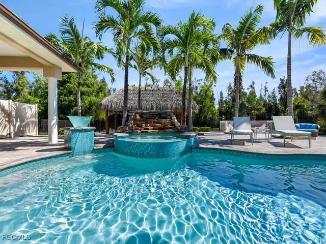 a view of a swimming pool with a garden and plants