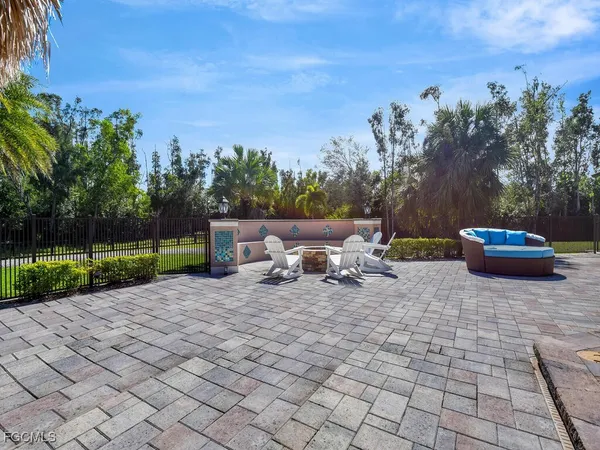 a view of a backyard with sitting area