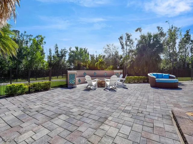 a view of a backyard with sitting area