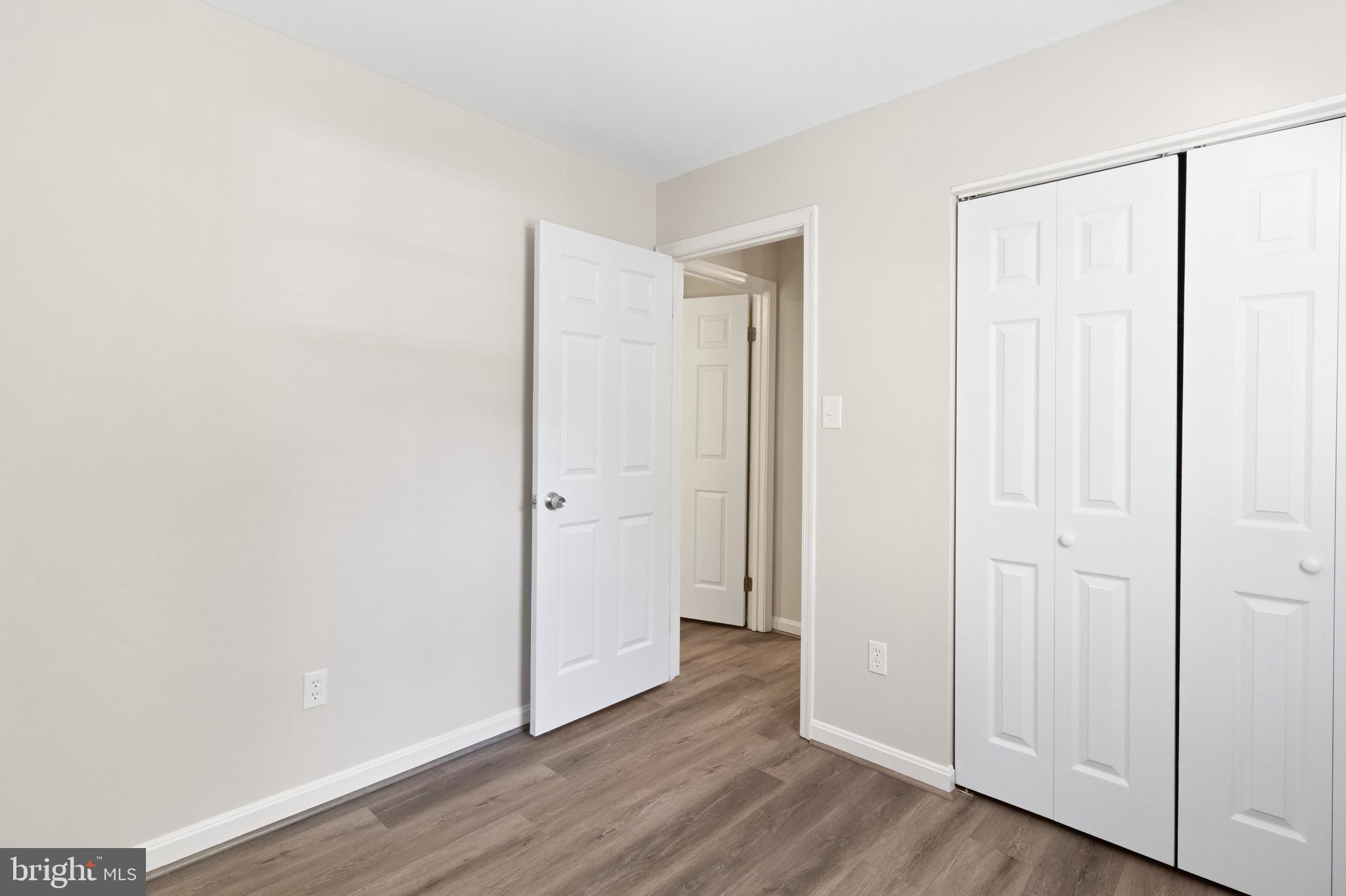 8581 Chester Grove Court Springfield, VA 22153 - Photo 29 of 38 a view of a room with wooden floor