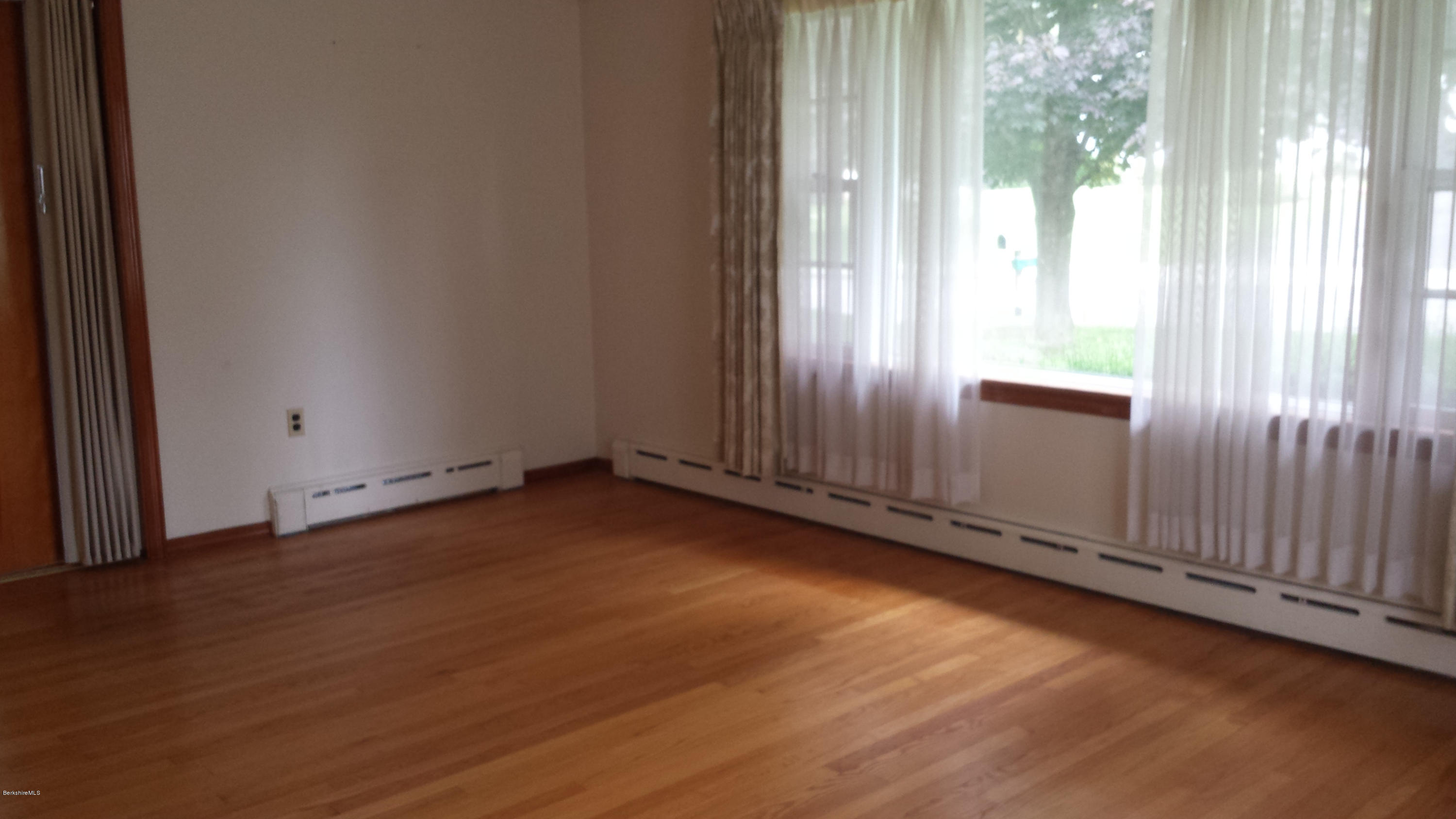 170 East Road Adams, MA 01220 - Photo 12 of 28 an empty room with wooden floor and windows