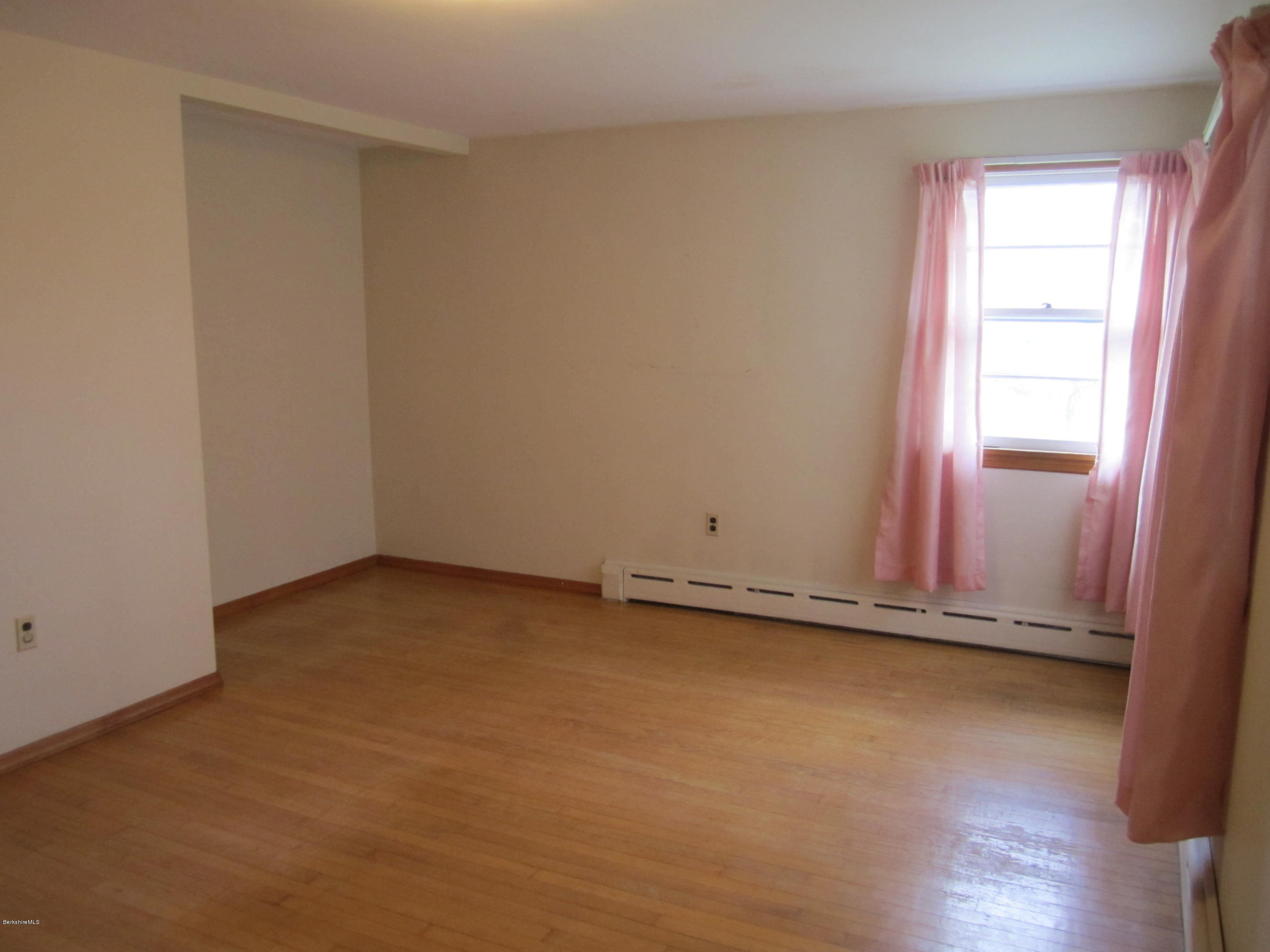 170 East Road Adams, MA 01220 - Photo 18 of 28 an empty room with wooden floor and windows