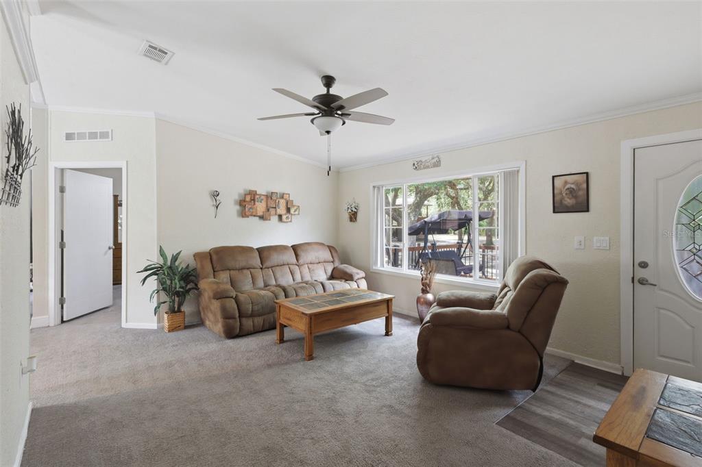 41736 Apollo Lane DeLand, FL 32720 - Photo 11 of 49 a living room with furniture and a window