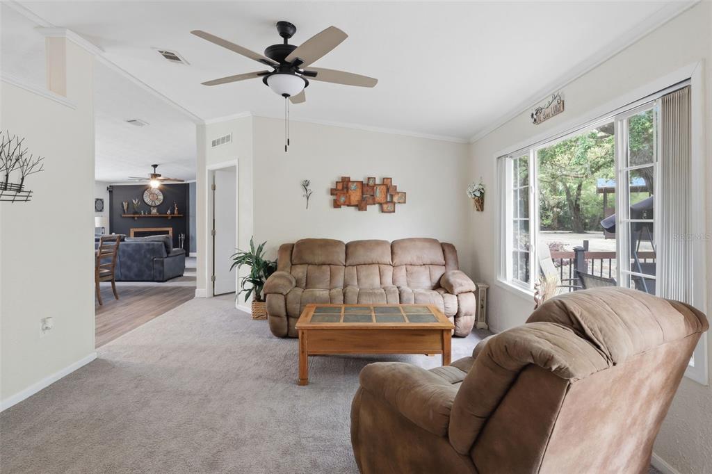 41736 Apollo Lane DeLand, FL 32720 - Photo 12 of 49 a living room with furniture and a large window