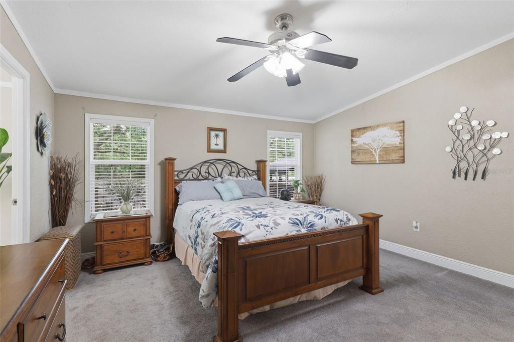 41736 Apollo Lane DeLand, FL 32720 - Photo 25 of 49 a bedroom with a bed and a window