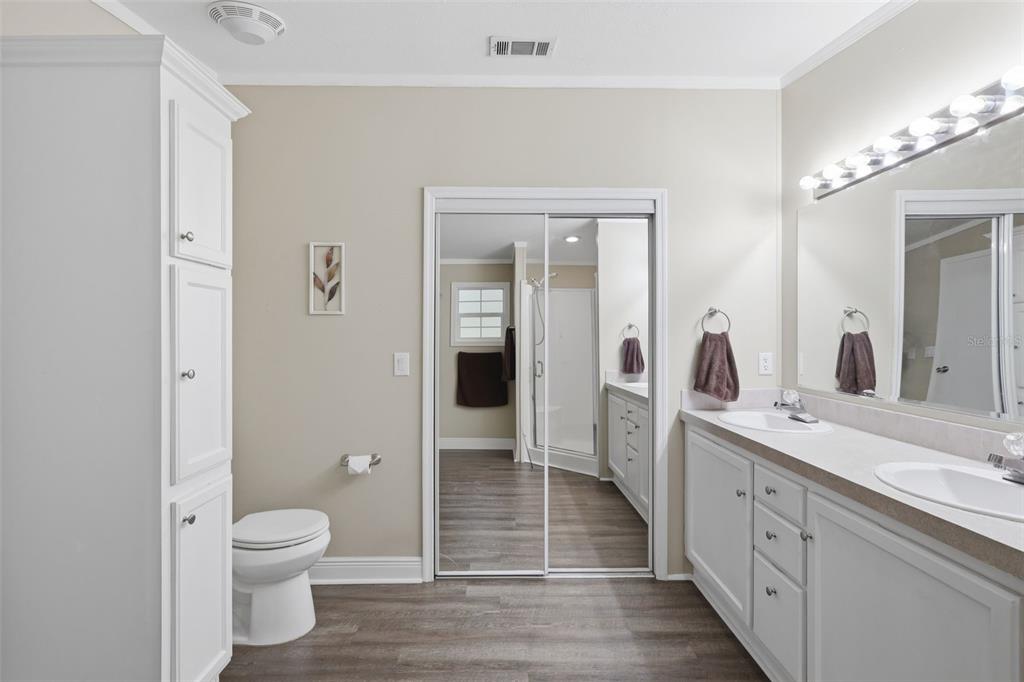 41736 Apollo Lane DeLand, FL 32720 - Photo 28 of 49 a spacious bathroom with a double vanity sink toilet and shower