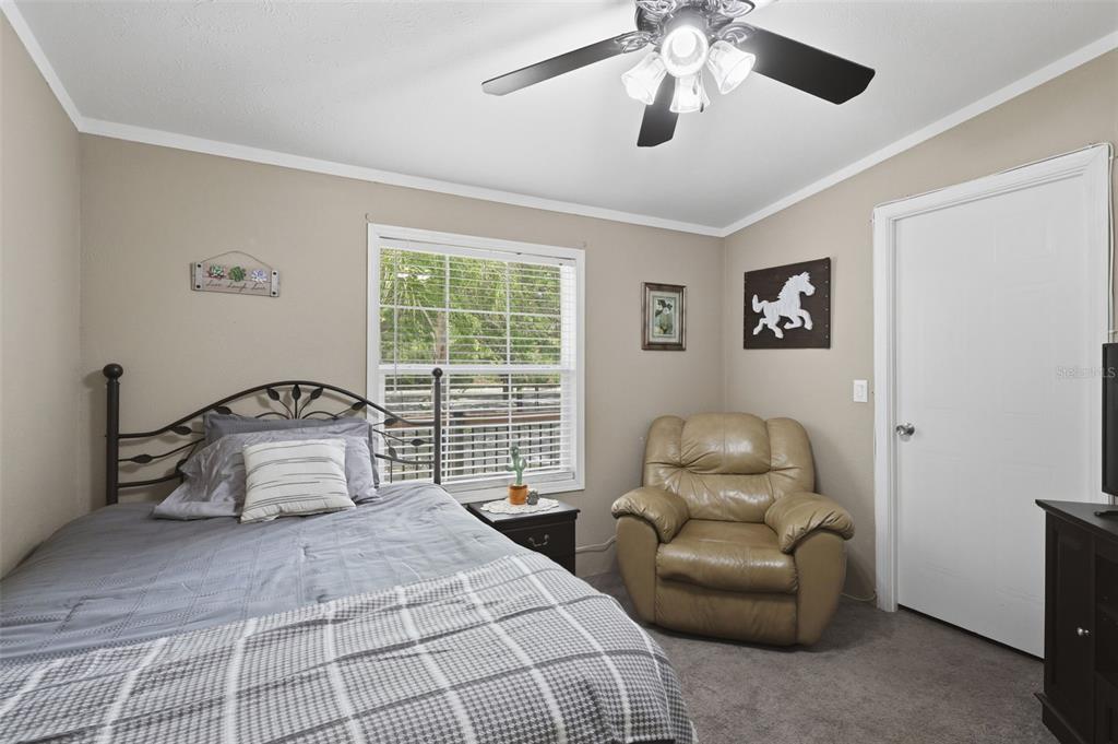 41736 Apollo Lane DeLand, FL 32720 - Photo 29 of 49 a bedroom with a bed and window