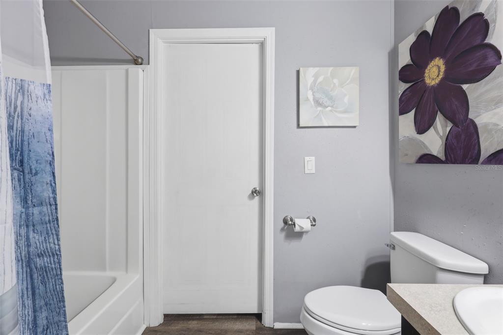 41736 Apollo Lane DeLand, FL 32720 - Photo 32 of 49 a bathroom with a toilet and a shower