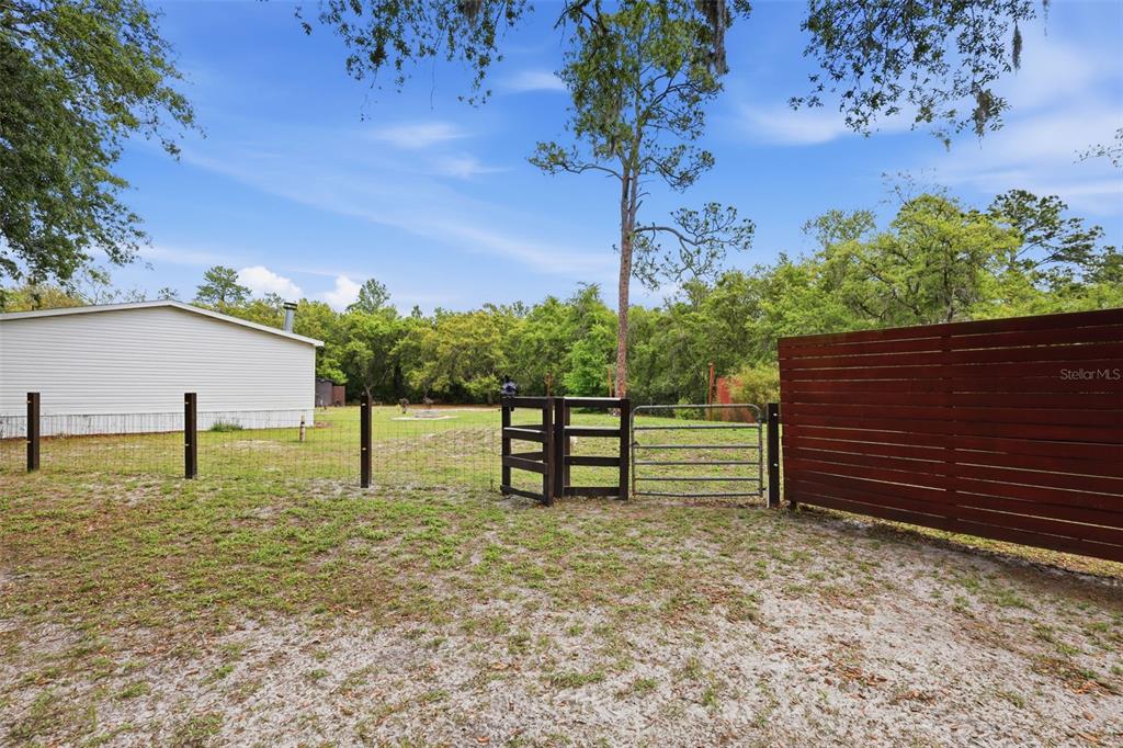 41736 Apollo Lane DeLand, FL 32720 - Photo 35 of 49 a view of a bench in the garden