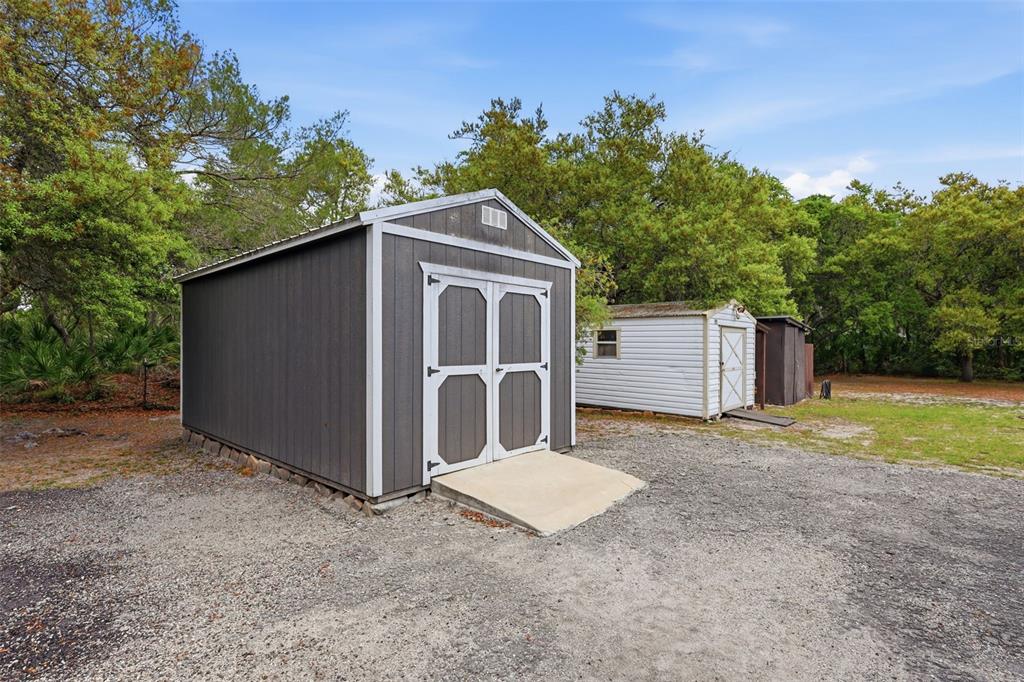 41736 Apollo Lane DeLand, FL 32720 - Photo 37 of 49 a house with trees in the background