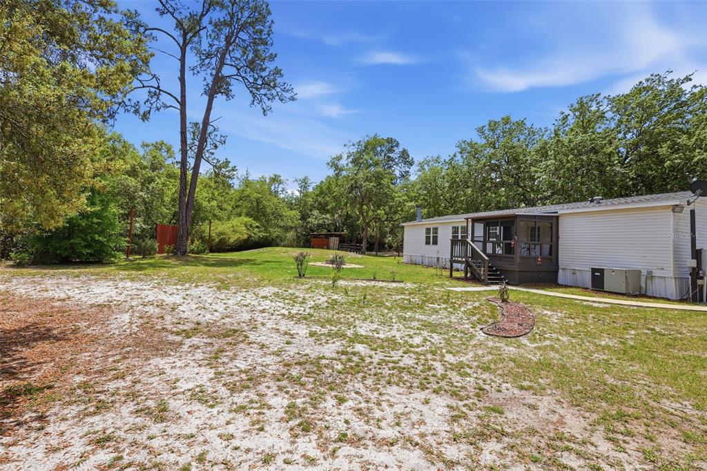 41736 Apollo Lane DeLand, FL 32720 - Photo 38 of 49 a view of a house with a yard