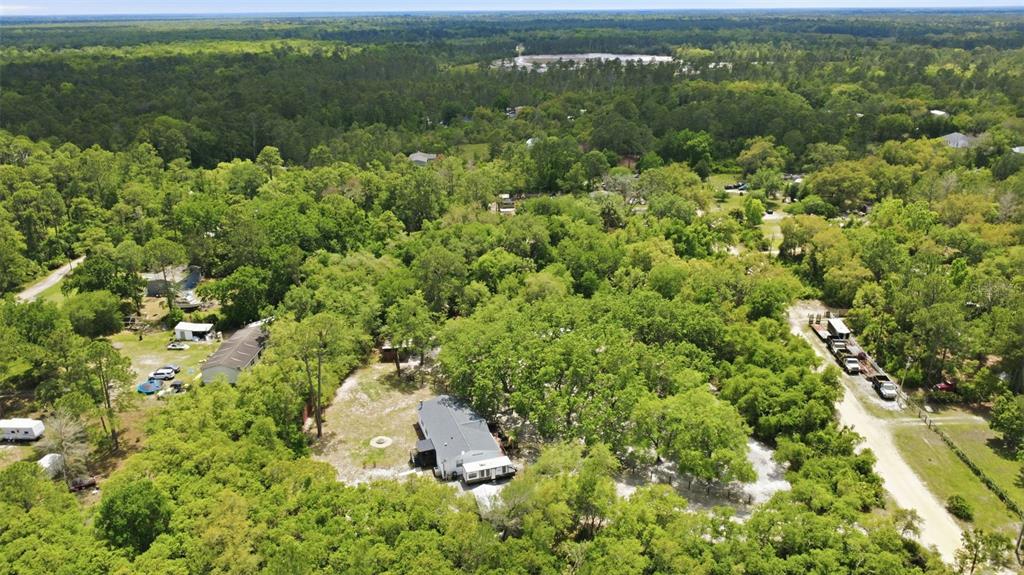 41736 Apollo Lane DeLand, FL 32720 - Photo 45 of 49 an aerial view of a houses with yard