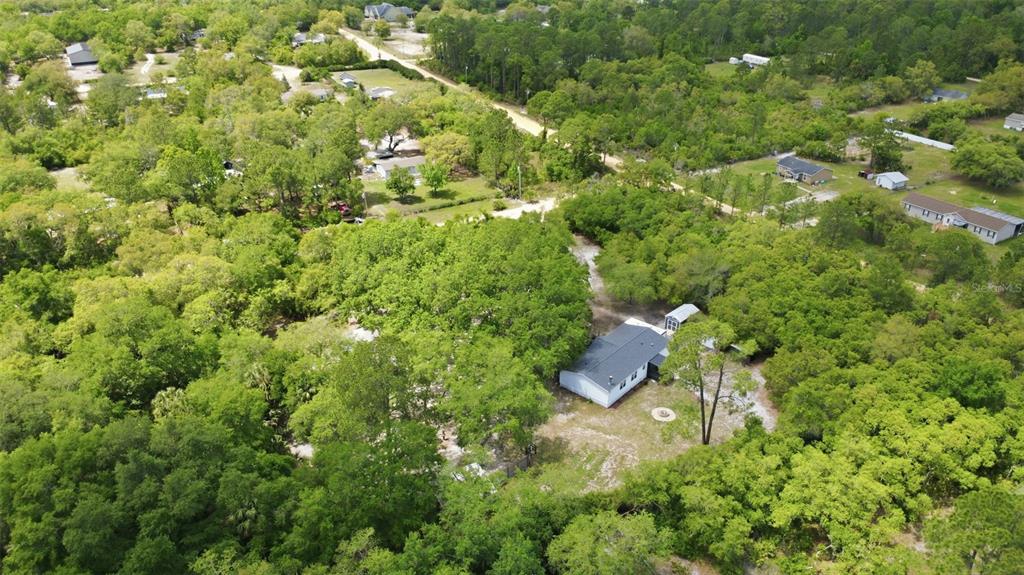 41736 Apollo Lane DeLand, FL 32720 - Photo 47 of 49 an aerial view of residential house with outdoor space and trees all around