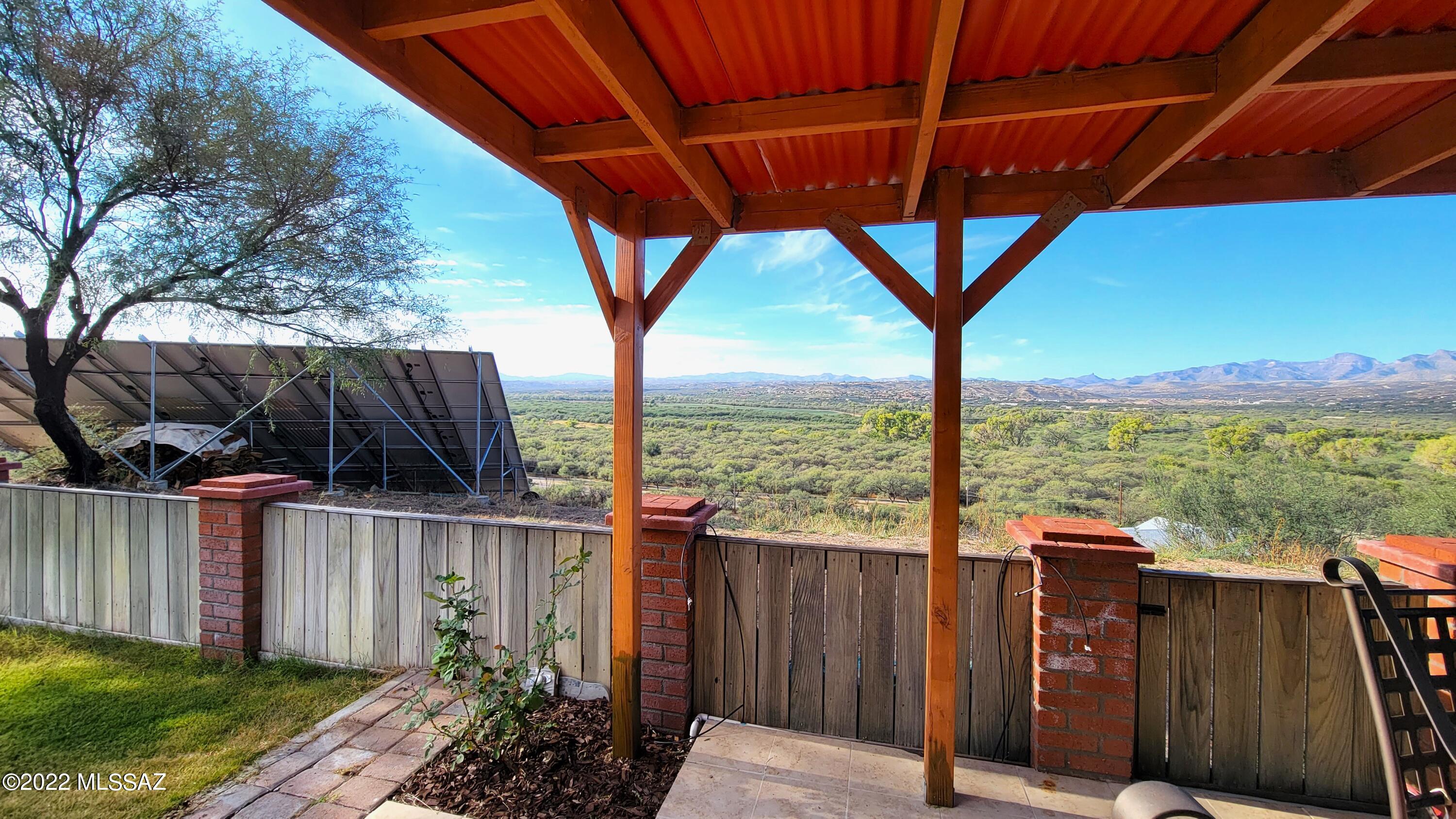 293 Valley View Drive Rio Rico, AZ 85648 - Photo 37 of 38 a view of a deck with wooden floor and outdoor space