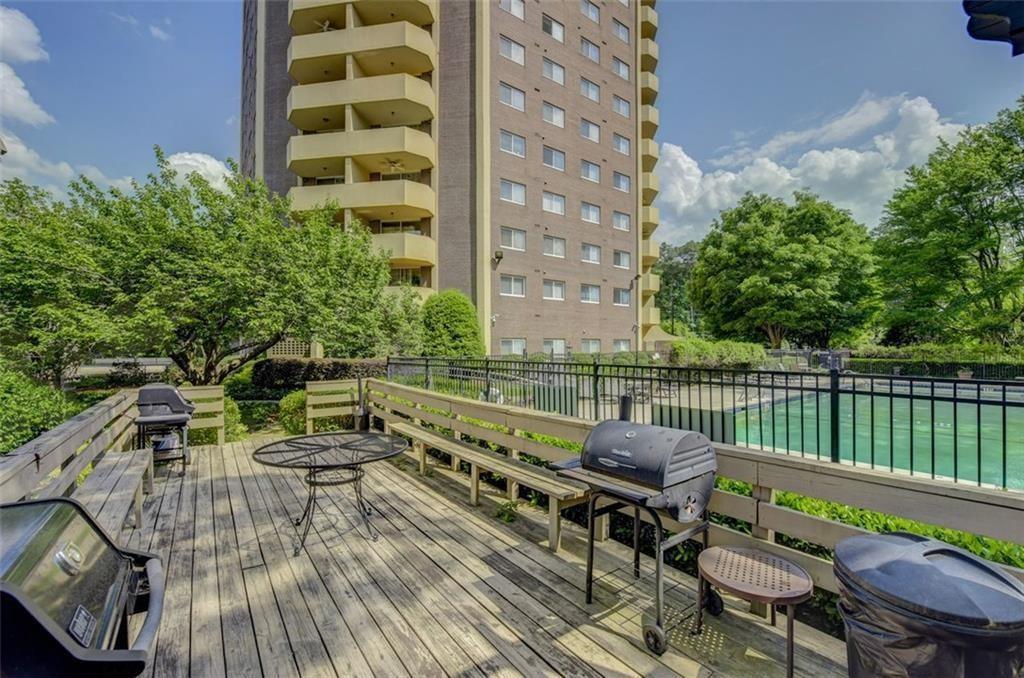 1501 Clairmont Road, Unit 1917 Decatur, GA 30033 - Photo 2 of 10 a view of balcony with wooden floor and outdoor seating