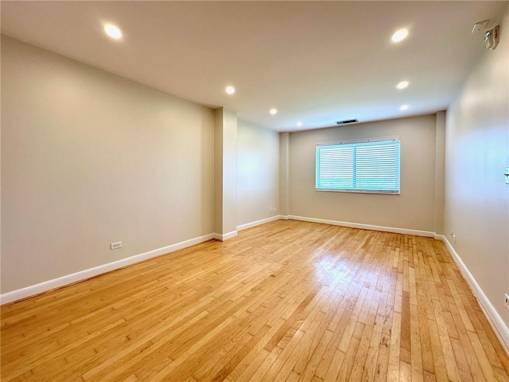 1501 Clairmont Road, Unit 1917 Decatur, GA 30033 - Photo 6 of 10 an empty room with wooden floor and windows