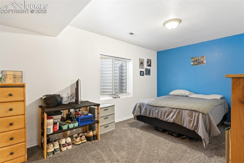 8135 Buschborn Road Peyton, CO 80831 - Photo 40 of 47 Basement Bedroom 2