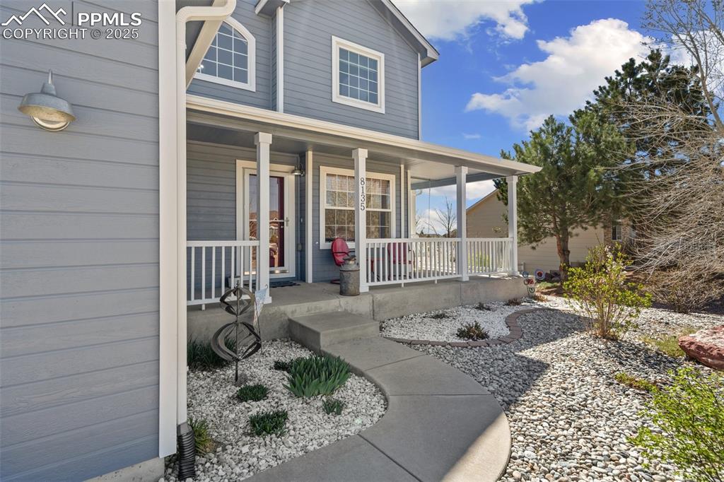 8135 Buschborn Road Peyton, CO 80831 - Photo 10 of 47 Beautiful large front porch with porch swing!