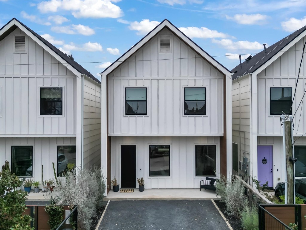 a front view of a house with garage